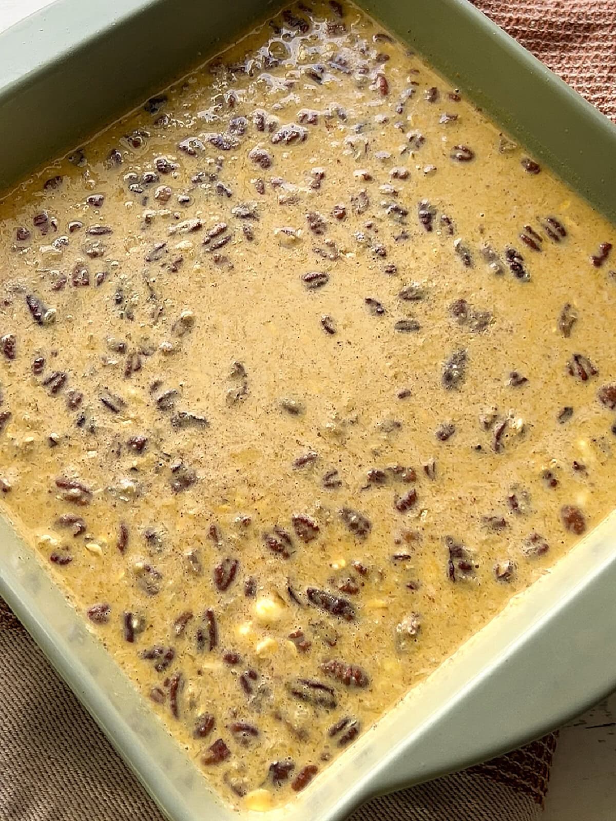 Mixture for Baked Pumpkin Oatmeal in a 9x9 inch square dish ready to bake.