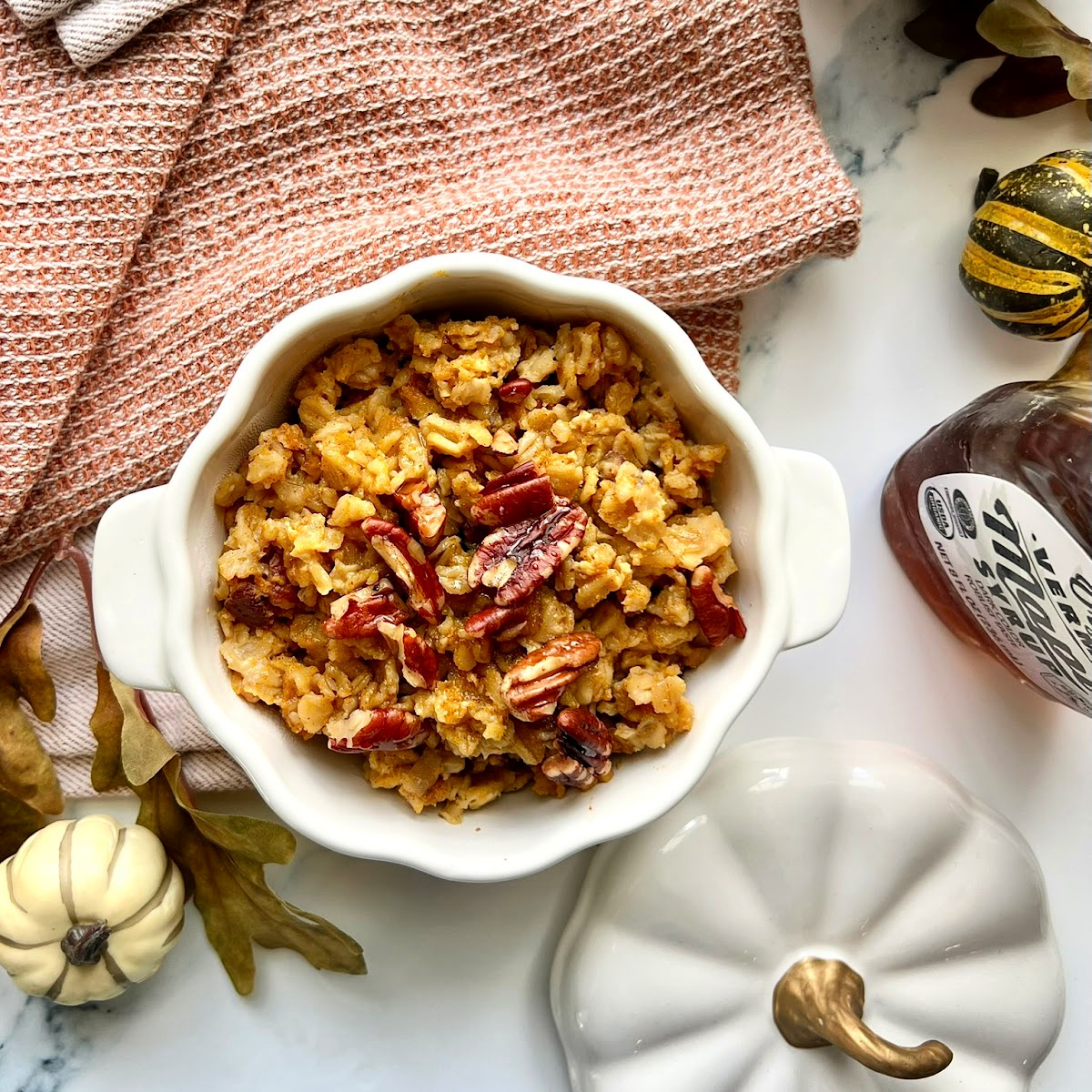 An overhead shot of Baked Pumpkin Oatmeal in a pumpkin shaped dish.