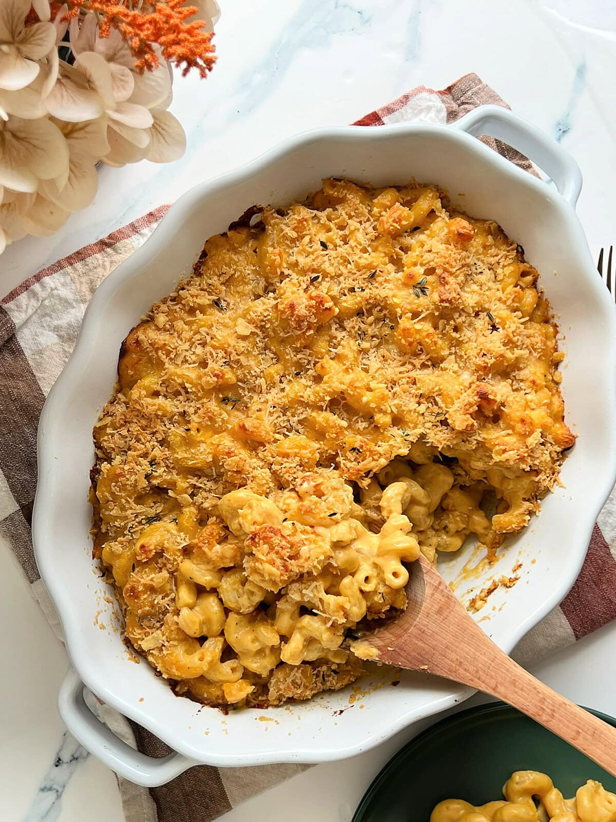 An overhead shot of Pumpkin Mac & Cheese in a white baking dish.