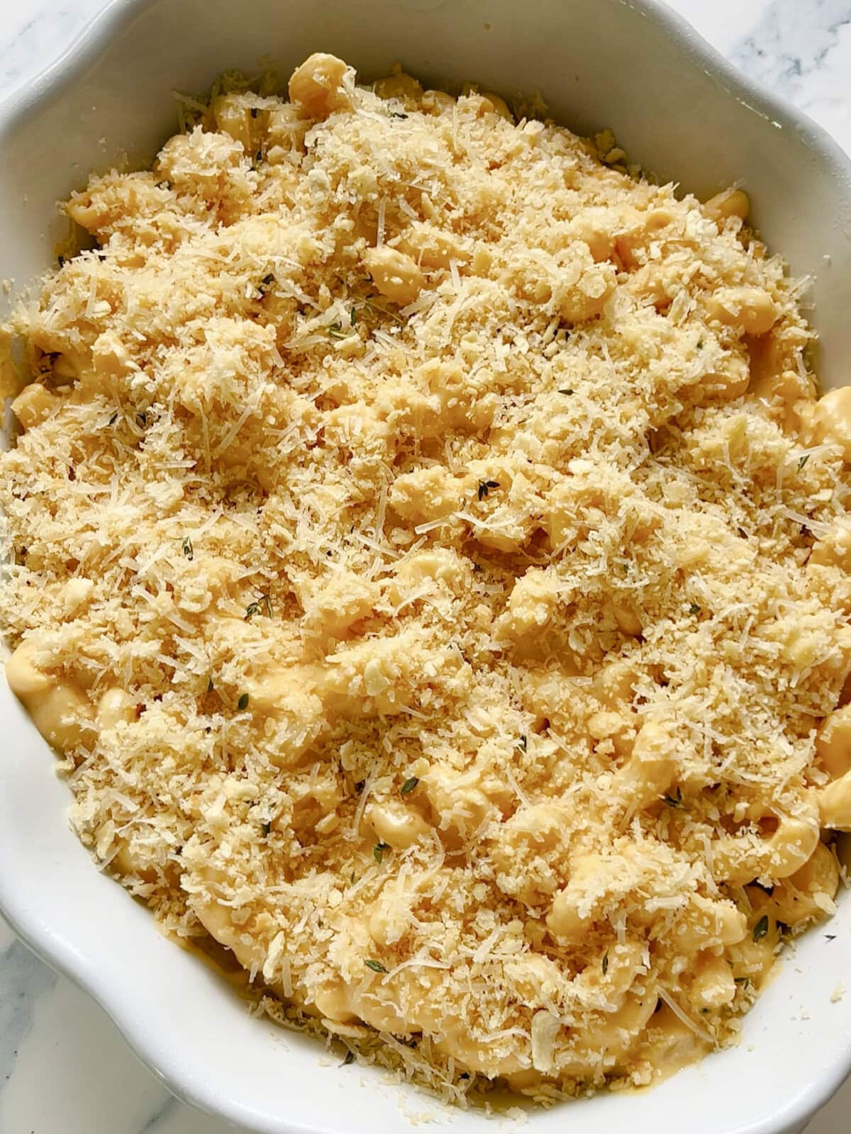Parmesan and breadcrumb topping on the top of Pumpkin Mac & Cheese before baking.