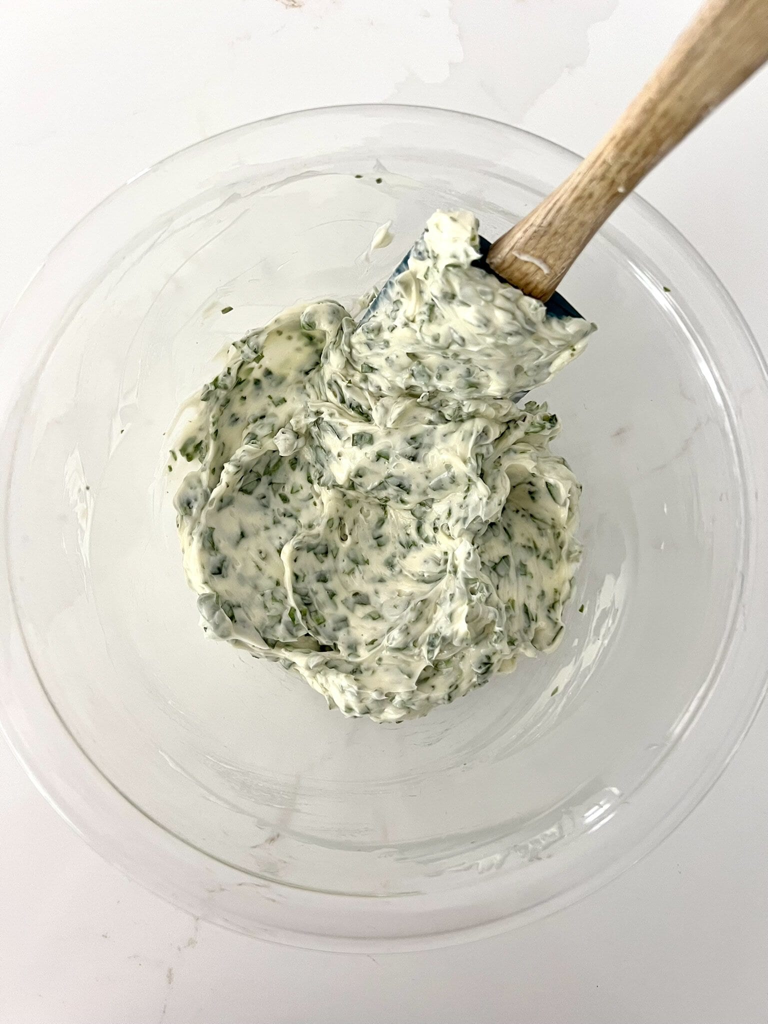 Chopped basil, softened butter and sea salt beaten together in a bowl.